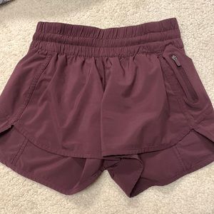 Maroon Lululemon tracker shorts. Size 4 and 4”